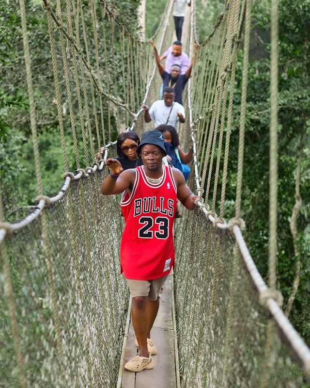 A group of tourist on a canopy walk in Ghana.